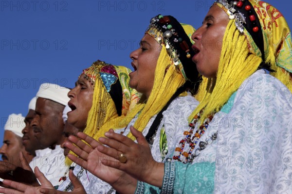 Women sing in traditional dress at the Berber Festival, Ma El Kelâa m'Gouna, Fête des Roses, Berber
