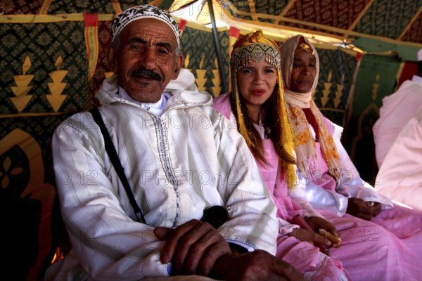 Traditional clothing and cultural atmosphere in the participant tent at the Fête des Roses, El