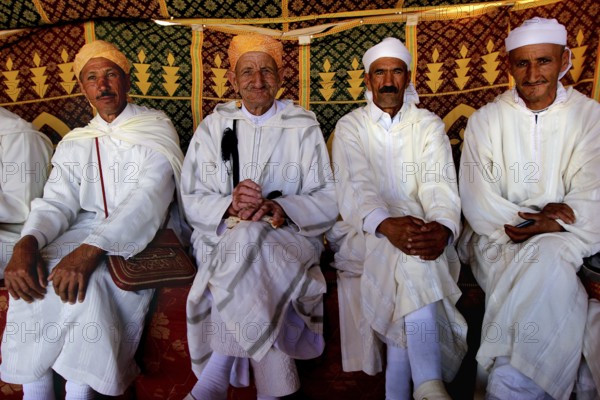 Four men wearing traditional clothes at the Fête des Roses in El Kelâa m'Gouna, El Kelâa M'gouna,