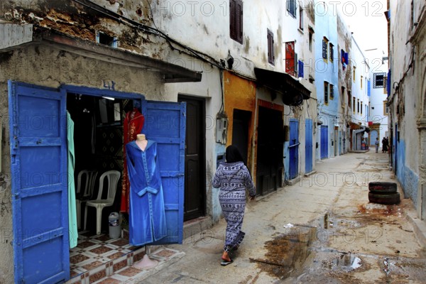 Lively alley with typical blue doors in Moroccan old town, Essaouira, Marrakesh-Safi, Morocco