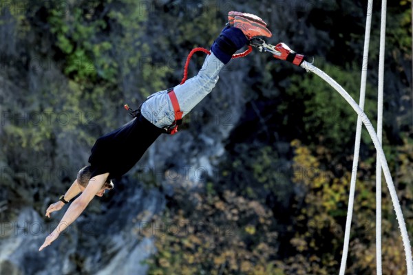 Person upside down in free fall from bungee jumping at Kawarau Bridge, Queenstown, Kawarau Bridge,