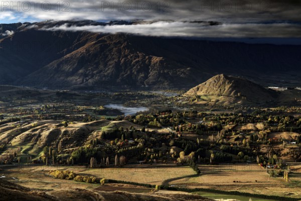 Breathtaking views from Coronet Peak with majestic mountains and dramatic clouds, Queenstown,