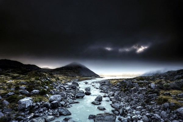 River course and rocky landscape under a dramatic sky in Hocker Valley, New Zealand, zero