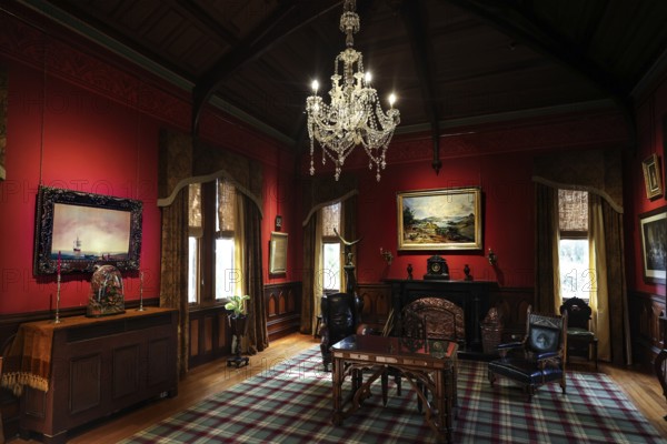 Sumptuous room in the castle with antique furniture and a large chandelier, Larnach Castle, Otago