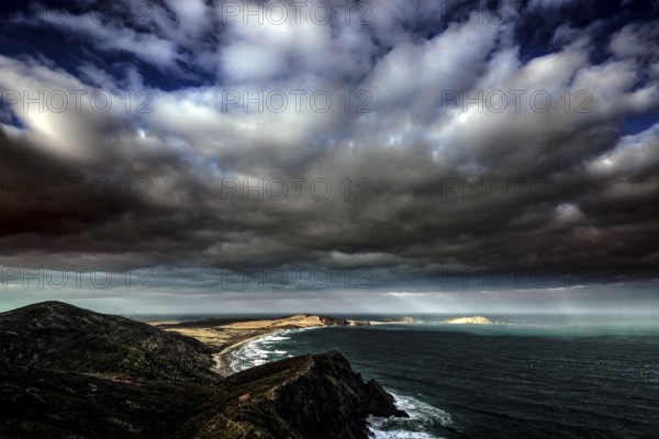 Dramatic sky over Cape Reinga and the New Zealand coastline, Cape Reinga, Ninety Miles Beach, New