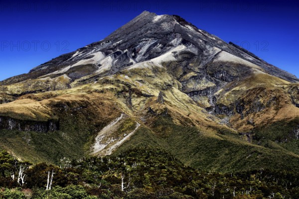 Impressive view of the summit of Mount Taranaki under clear blue skies in Mt Egmont National Park,