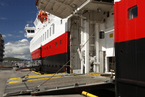 Hurtigruten ship on the quay with open cargo hatch under bright blue sky, Hammerfest, Finnmark,