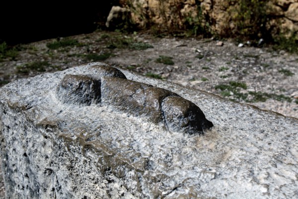Stone relief in the form of a phallic symbol in the ruins of Volubilis, Volubilis, Fès-Meknès,