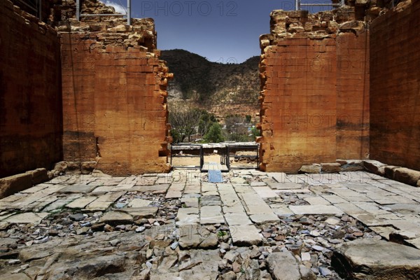 Ruins inside the Great Temple of Yeha with views of the surrounding landscape