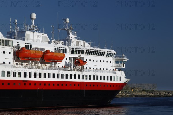 Hurtigruten ship on open sea against blue sky and calm water surface near Svolvær, Svolvær,
