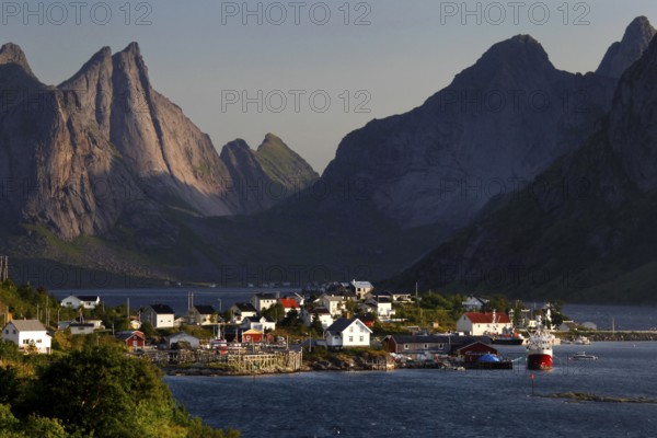 Hamnøay village with a view of the sea and distinctive mountain scenery of Lofoten, Hamnøay,