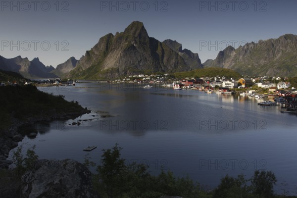 View of Reine and Hamnøay with water and impressive mountain scenery of Lofoten, Reine, Moskenesøy,
