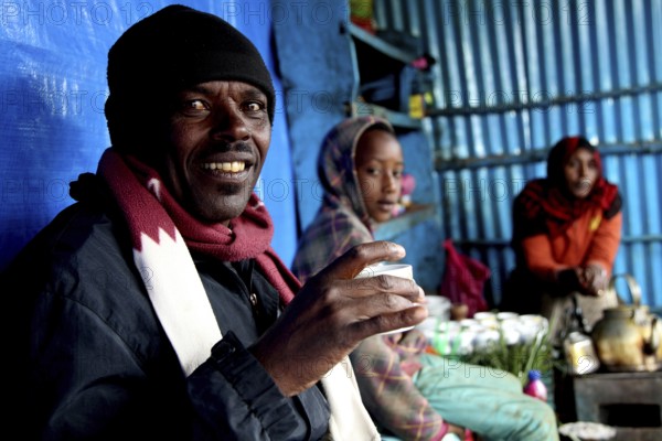 Man in Rira at a coffee ceremony in the Bale Mountains, convivial atmosphere, Rira, Bale Mountains,