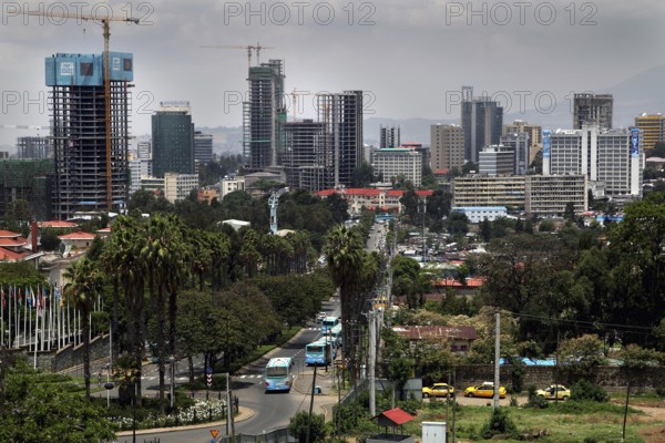 Modern skyline with skyscrapers and cranes surrounded by vegetation, Addis Ababa, Ethiopia