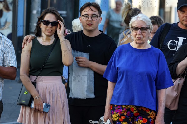 Three people wearing casual clothes in an urban environment in Tallinn, Tallinn, South Alinn,