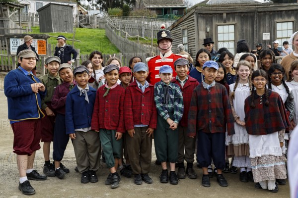 Group of children in period costumes with a soldier in Sovereign Hill, Ballarat, Ballarat,