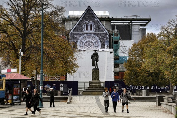 Cathedral and monument at Cathedral Square in Christchurch with passers-by, Christchurch,
