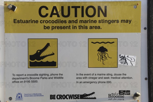 Warning sign on Cable Beach warns of crocodiles and jellyfish in the area, Broome, Western