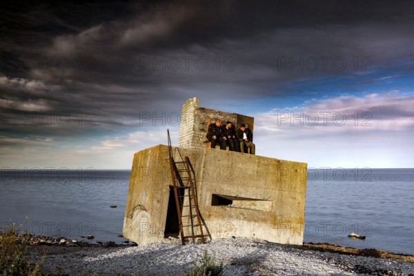 Abandoned bunker on a stormy coast with dramatic clouds, Sääre, Saaremaa, Estonia