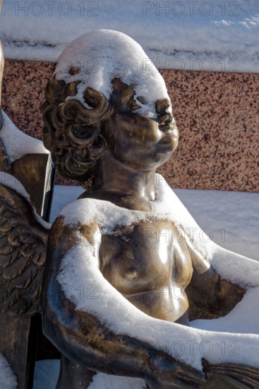 A snowy angel, figure at the Felix Mendessohn Bartholdy monument in winter with snow, Leipzig,