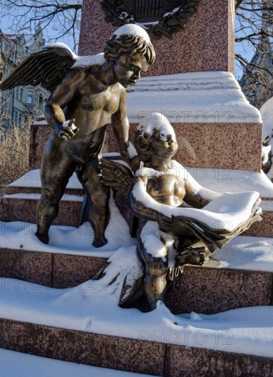 Two snowy angels, figure at the Felix Mendessohn Bartholdy monument in winter with snow, Leipzig,