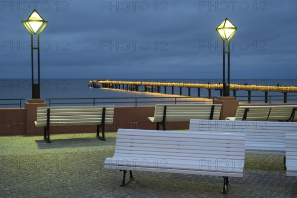 Kurplatz am spa hotel, in the back the pier and Baltic Sea, illuminated, Blaue Stunde, Binz,
