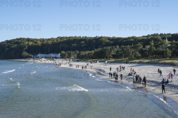 Tourists on the beach in autumn, Baltic Sea, Binz, seaside resort, Rügen island,