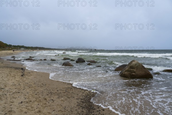 Boulders and waves on the coast, sandy beach, Baltic resort Göhren, Baltic Sea, Rügen island,