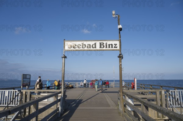 Tourists on the pier, sign Seebad Binz, Binz, seaside resort, Rügen island, Baltic Sea,