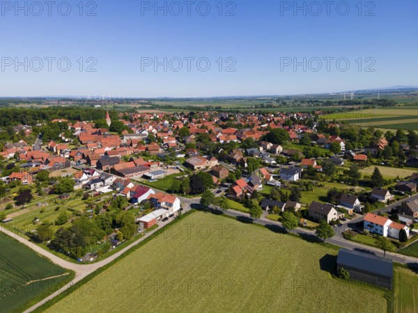 Summer village landscape with red roofs and surrounding fields, Adenstedt, Ilsede municipality,
