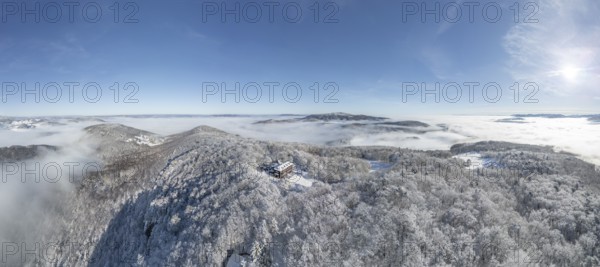Aerial view of snowy stone walls with shelter and fog in the valley, Schwarzensee, Weissenbach an