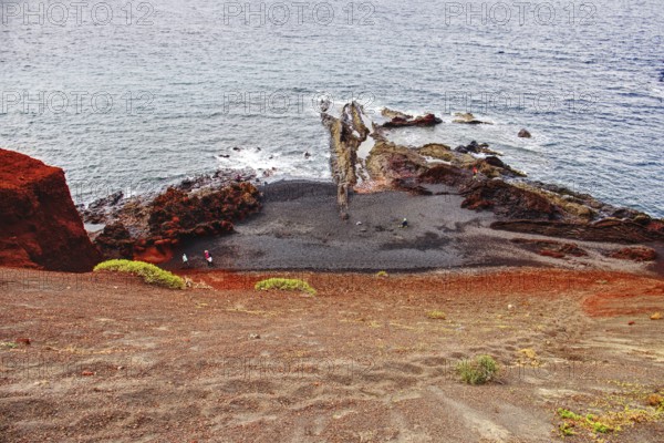 Panoramic view of the rugged coastline with red rocks and calm sea, Chargo Verde El Golfo Lanzarote