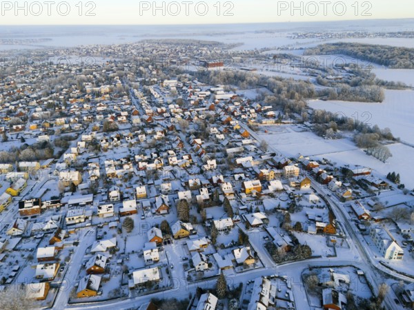 Winter aerial view of a village with snowy houses and landscapes in the background, Aerial view,