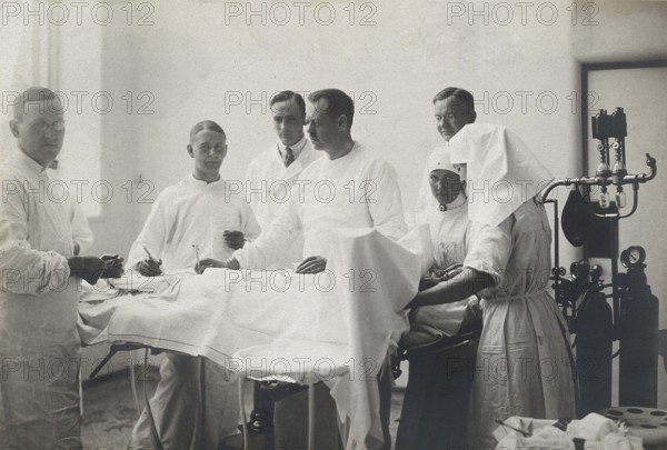 Einar Key (fourth from left), a Swedish surgeon, in an operating theatre with other members of the