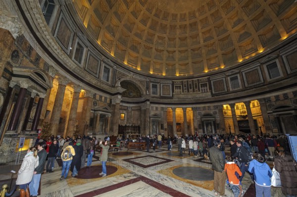 Tourist flow of visitors in Pantheon interior of ancient Roman temple with dome, coffered ceiling,