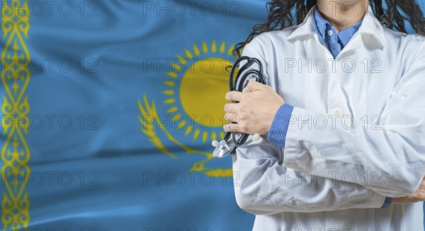 Healthcare professional with Kazakhstan flag background. Professional doctor holding stethoscope on