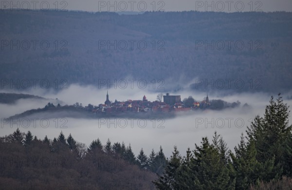 Aerial view of a medieval town, Dilsberg mountain fortress in a fog landscape in the Odenwald near