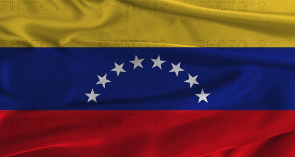 Flag of Venezuela with fabric textured background. Close up of National flag of Venezuela with