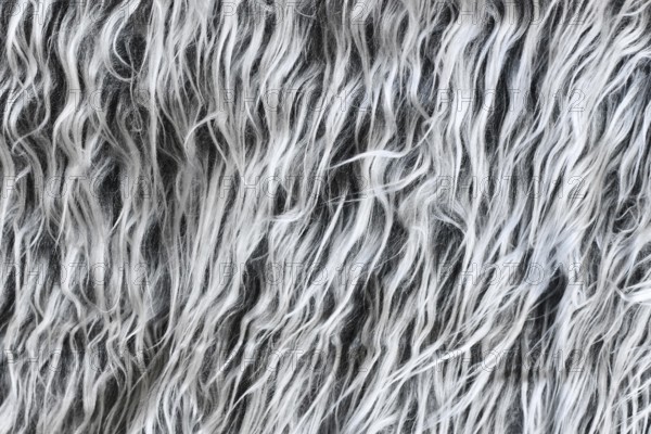 Close up of shaggy sheep-like gray synthetic fake fur