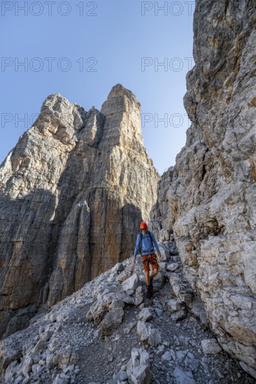 Climbers on the Via Ferrata Bocciere Centrale via ferrata, spectacular mountain landscape with