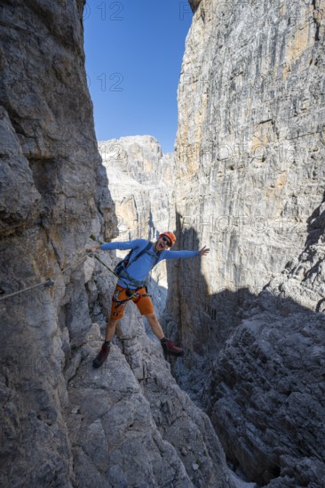 Mountaineers happy on the Via Ferrata Bocciere Centrale via ferrata, spectacular mountain landscape