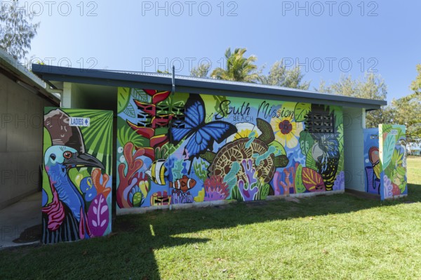 August 19, 2020. Artistically painted public toilet block featuring nature murals in a tropical