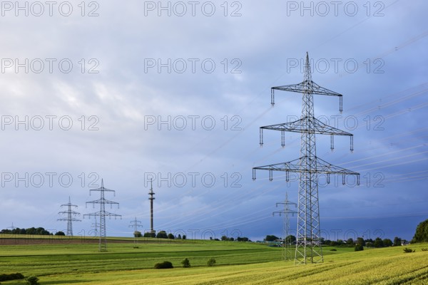 Landscape, high-voltage pole, high-voltage line, fields, trees, bushes, cloudy, sunny,