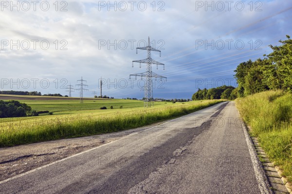 Landscape, road, high-voltage power line, high-voltage pole, television tower, fields, trees,