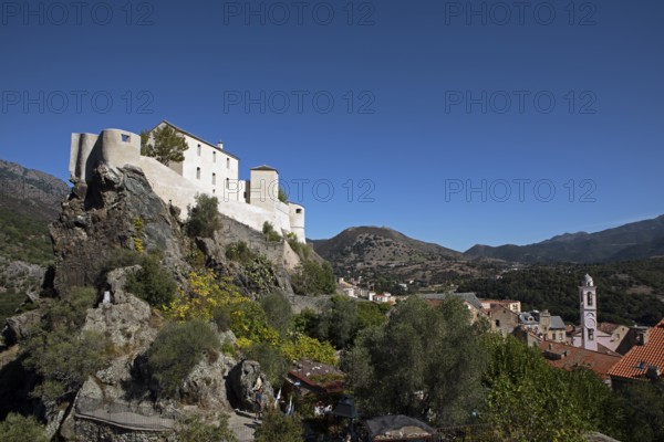 Citadel with the bastion Eagle's Nest, mountain town of Corte, on the right the village of Corte,