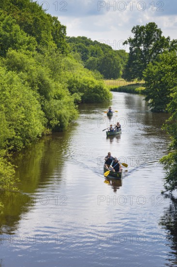 Canoeists do water sports on the Hunte near Astrup, Barneführer Holz, Wardenburg, Lower Saxony,