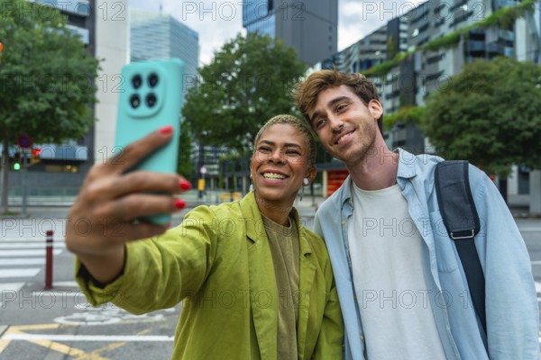 Diverse couple smiling and taking a selfie with a smartphone, sharing a moment of connection and