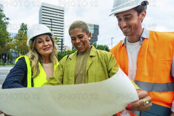 Diverse team of architects and construction professionals collaborating and discussing building