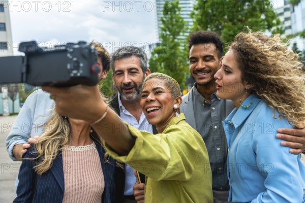 Diverse group of smiling business professionals vlogging outdoors, capturing content together for