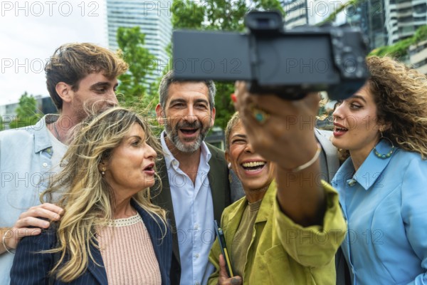 Group of diverse business professionals and colleagues enjoying a moment together, laughing and